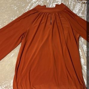 Burnt orange bell sleeves